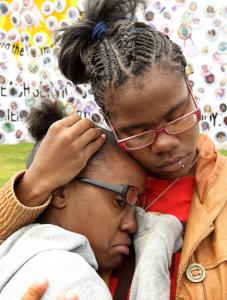 Raylisa, 16 (left), and Rayshonda Williams, 19, walked yesterday in memory of their brother Da-Keen Galloway.