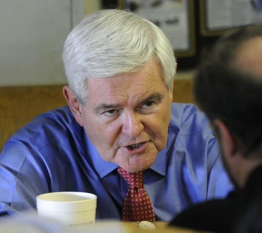 Newt Gingrich says his “food-stamp president’’ comment was taken out of context.