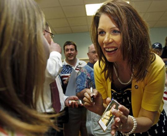 Representative Michele Bachmann gave an autograph to a young girl at an event to pay tribute to veterans yesterday in Dover, N.H. Bachmann, a Minnesota Republican and a favorite of the Tea Party movement, said if she runs, she will focus on jobs.