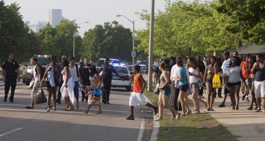 Police dispersed crowds at Carson Beach in Boston after fights broke out. Officials say hundreds of unruly youths boarded trains at JFK/UMass Station and started fights elsewhere.