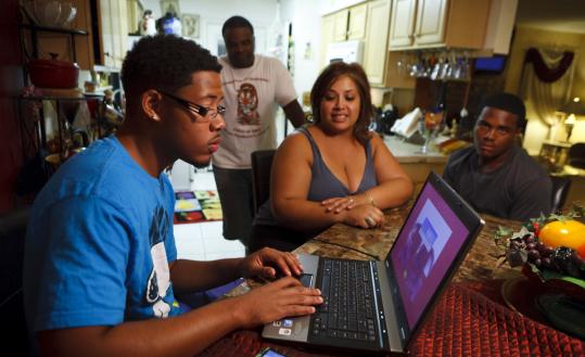 Racquel and Willie Williams (back) of Cypress, Texas, were angry over tickets that their sons received at school.
