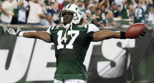 Wide receiver Plaxico Burress celebrated his return to football with a touchdown catch in the Jets’ season-opening win over the Cowboys.