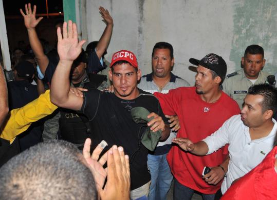 Nationals catcher Wilson Ramos waves to well-wishers as he arrives at his home after being rescued from kidnappers.