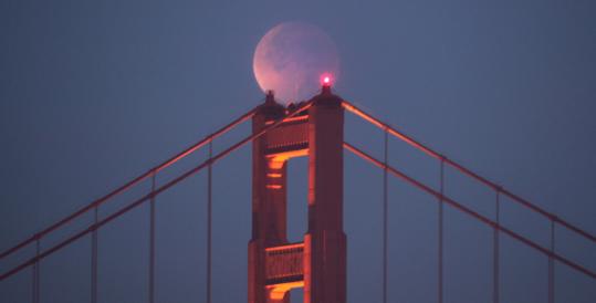 The moon as it appeared above San Francisco’s Golden Gate Bridge yesterday in a total eclipse.
