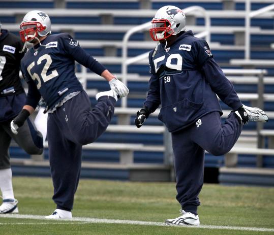 Patriots linebackers Dane Fletcher (52) and Gary Guyton should have a busy afternoon Sunday trying to contain Broncos quarterback Tim Tebow.