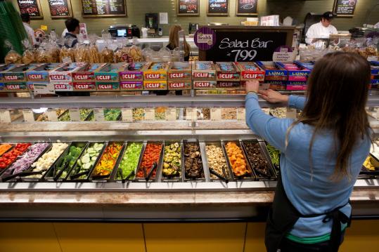 The salad bar is smaller at the Whole Foods in Jamaica Plain. There is no trail mix bar or a place to eat it, and the meat counter has disappeared.