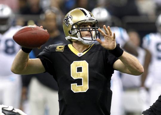Drew Brees set NFL records for passing yards (5,476) and completion percentage (71.2).