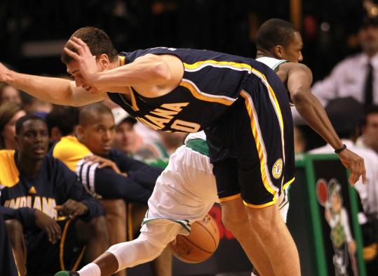 Rajon Rondo leaves Tyler Hansbrough in the lurch, driving around the Pacers’ big man in the first half.