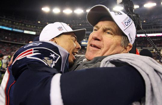Bill Belichick had reason to hug Sterling Moore (left) at the end of Sunday’s game.