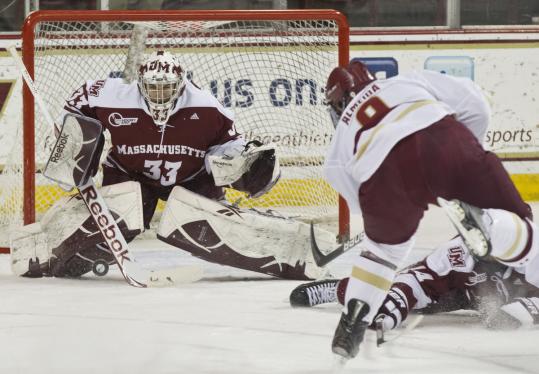 Boston College’s Barry Almeida is denied by UMass goalie Kevin Boyle during the teams’ scoreless first period at Conte Forum in a Hockey East quarterfinal.