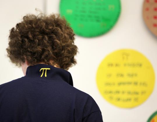 Zack Plummer sported the Greek letter pi on his collar to celebrate Pi Day at Hanover High School. Right, Dominique Notarangelo’s pie.