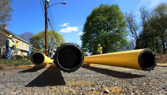Contractors worked on installing a new gas line on Stewart Road in Needham on Thursday to meet the growing demand for natural gas service.