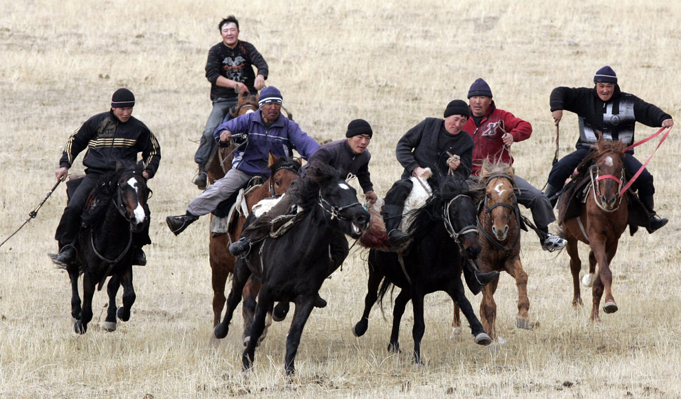 Mounted Kyrgyz men play