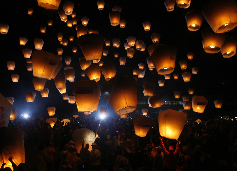 Sky lanterns float into the