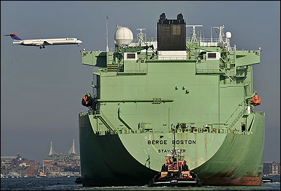 The Berge Boston, a liquefied natural gas tanker on its way to the Distrigas terminal in Everett, headed into Boston Harbor under the flight path of Logan International Airport. The weekly shipments have drawn extraordinarily tight security since the Sept. 11 terror attacks.