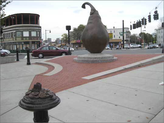 Everett Square has been home to Clapp's Favorite Pear, an enormous bronze fruit that sits beside the busy Dorchester intersection, since 2007. Now, Laura Baring-Gould, the artist behind the pear, has installed 10 smaller sculptures around it with historical inscriptions. Dorchester was an agricultural center, and the Clapp pear was cultivated in Dorchester in the 19th century. 'For me, the pear is a wonderful metaphor for the people of Dorchester. Because it's known to have a tough skin, and be sweet inside,' said Baring-Gould, who wanted to make a statue that was about the neighborhood's history, and 'not just the history of another person on a horse.'