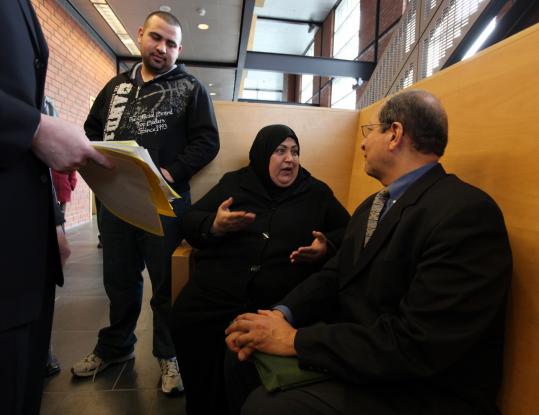 Awatif Albadri and her son, Anas Alhamdani (left), spoke with interpreter Bashier Doss in Chelsea District Court last month concerning her familys efforts to avoid being evicted.