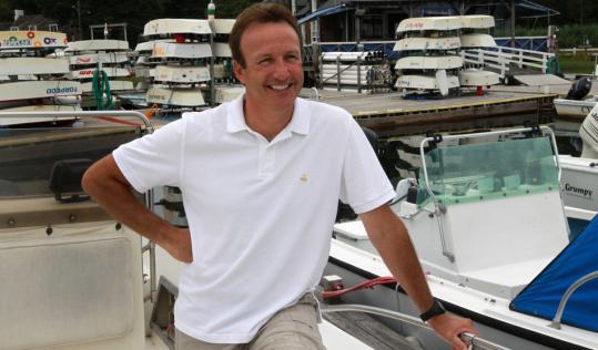 Anthony Everett, on his boat at Cohasset Yacht Club, has taken to the South